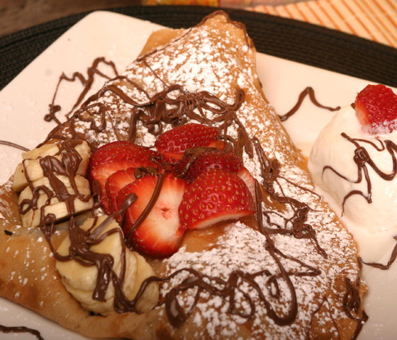 Order THE FAMOUS CREPE - Strawberry, Banana, Nutella, Ice Cream and Whipped Cream Crepe food online from Creperie store, New York on bringmethat.com