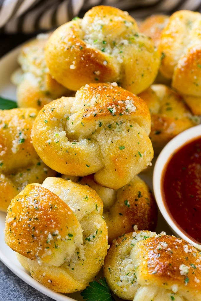 Order Garlic Knots - 1 Piece food online from Cousins Pizza store, Norwood on bringmethat.com