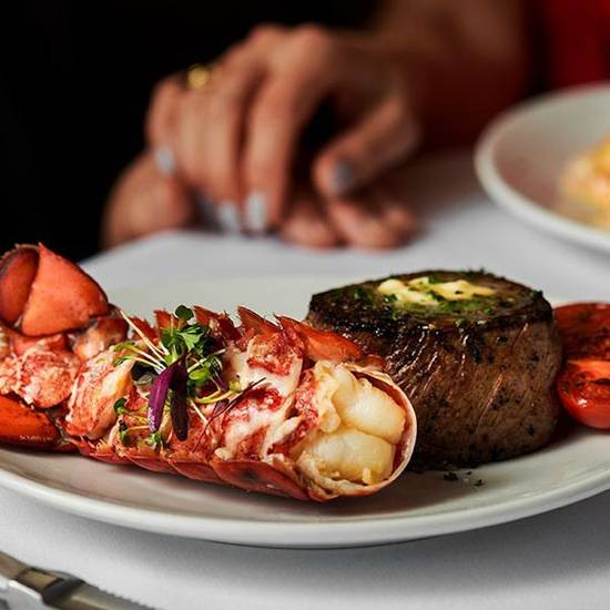 Order Petite Filet Mignon & Lobster Tail Scampi food online from Fleming's Prime Steakhouse & Wine Bar store, The Woodlands on bringmethat.com