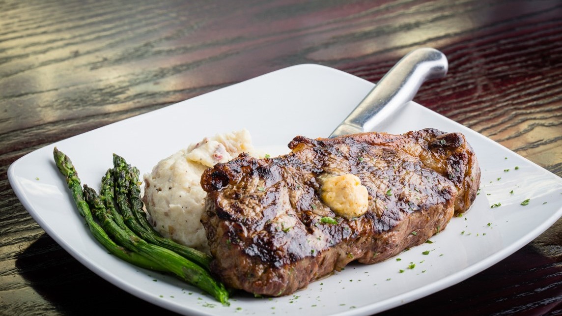 Order Hand Cut NY Strip food online from Sedona Taphouse store, Fredericksburg on bringmethat.com