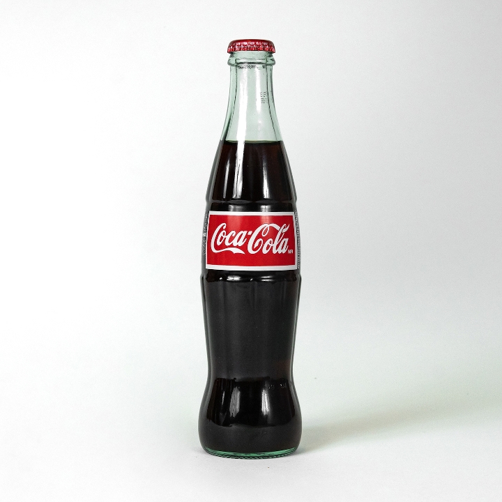 Order Mexican Coke (bottle) food online from Pizzaoki store, San Francisco on bringmethat.com