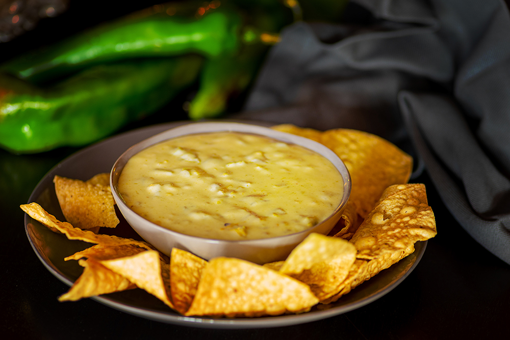 Order Green Chile Queso Dip - PINT food online from Lovecraft store, Phoenix on bringmethat.com