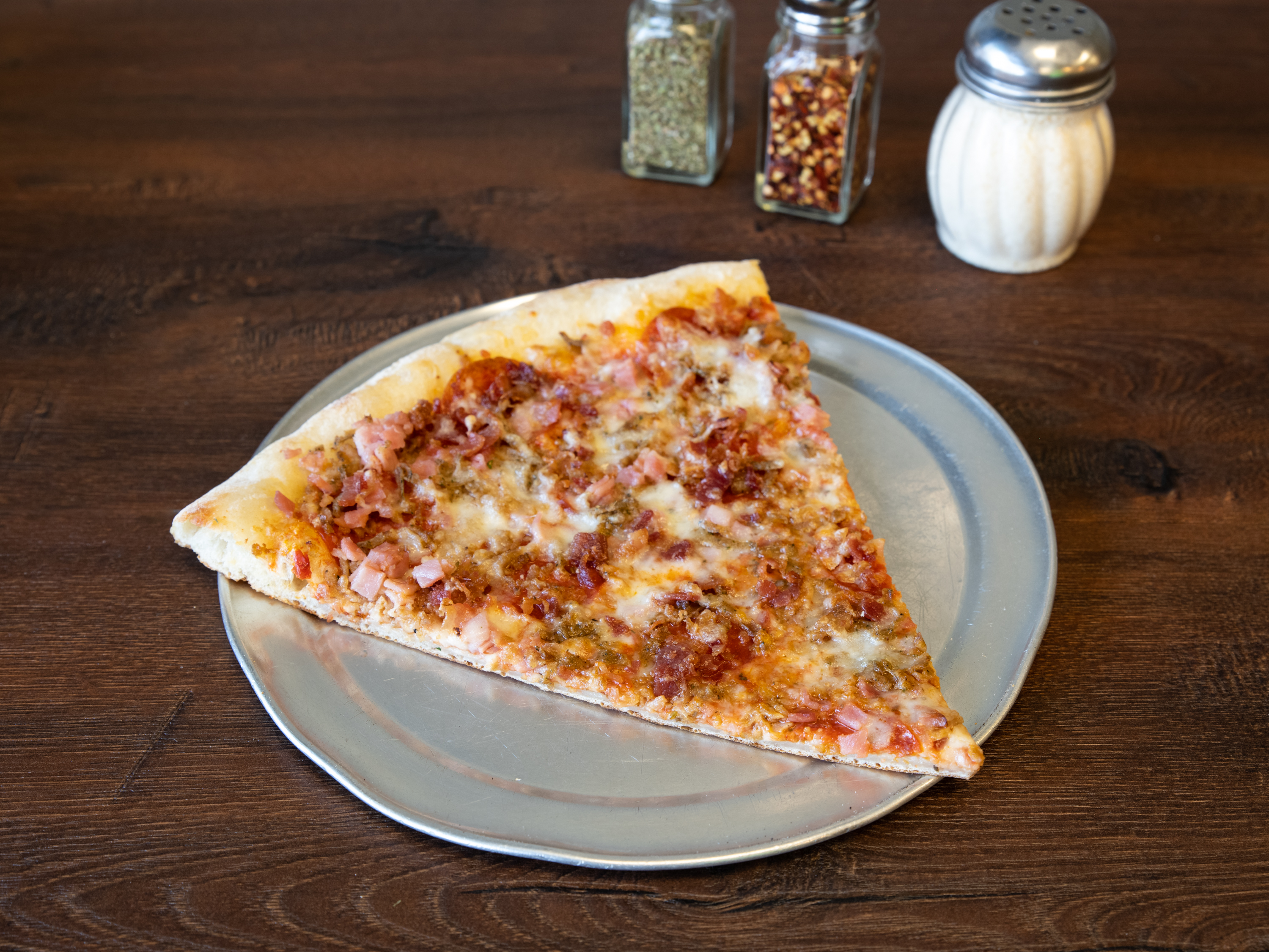Order Carnivore's Delight Pizza food online from Italian Village Pizza store, Orlando on bringmethat.com