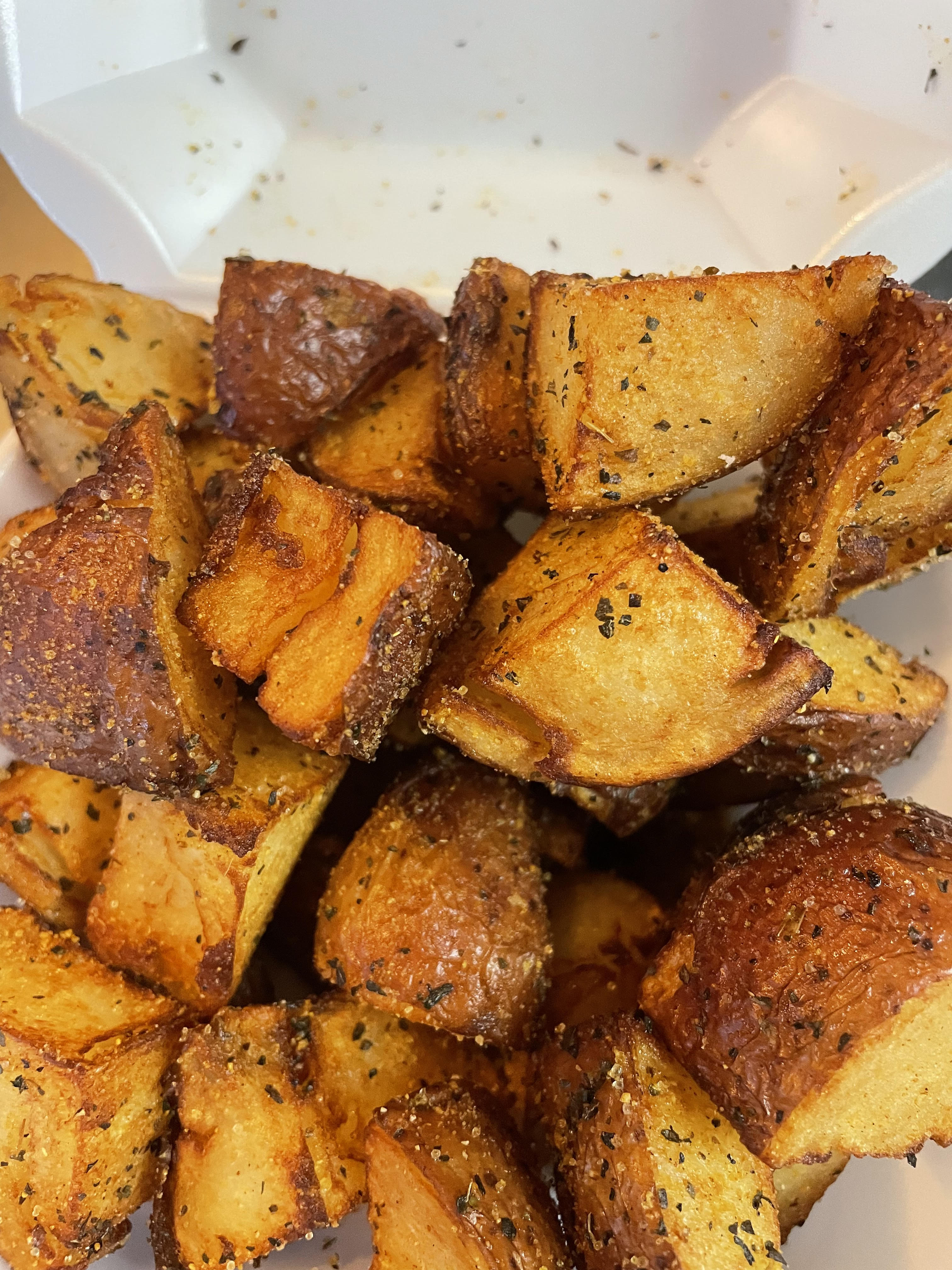 Order A9. Seasoned Potato Wedges with Herbs food online from Philly's Seafood store, Philadelphia on bringmethat.com