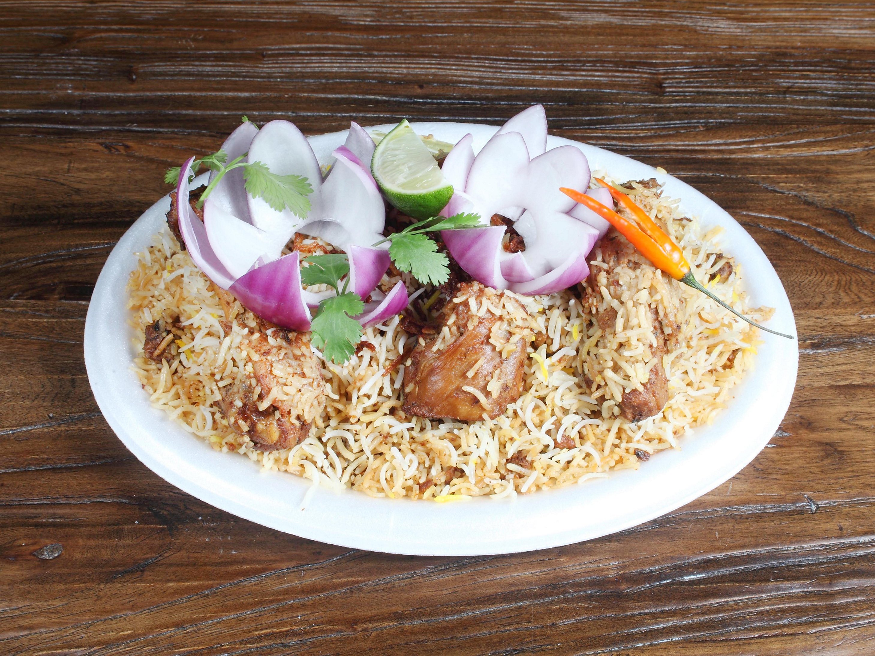 Order Chicken Dum Biryani food online from Nawabs Kebabs store, Charlotte on bringmethat.com