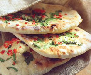 Order Chili Naan food online from Shimla Peppers store, Naperville on bringmethat.com