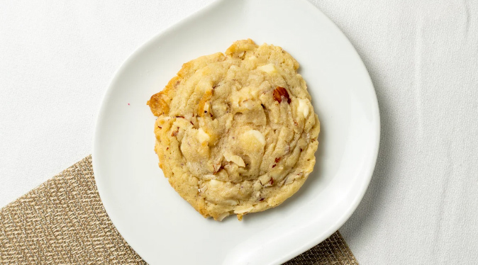 Order Almond White Chocolate Cookie food online from Cosmic Cookie Bakery store, Charlotte on bringmethat.com