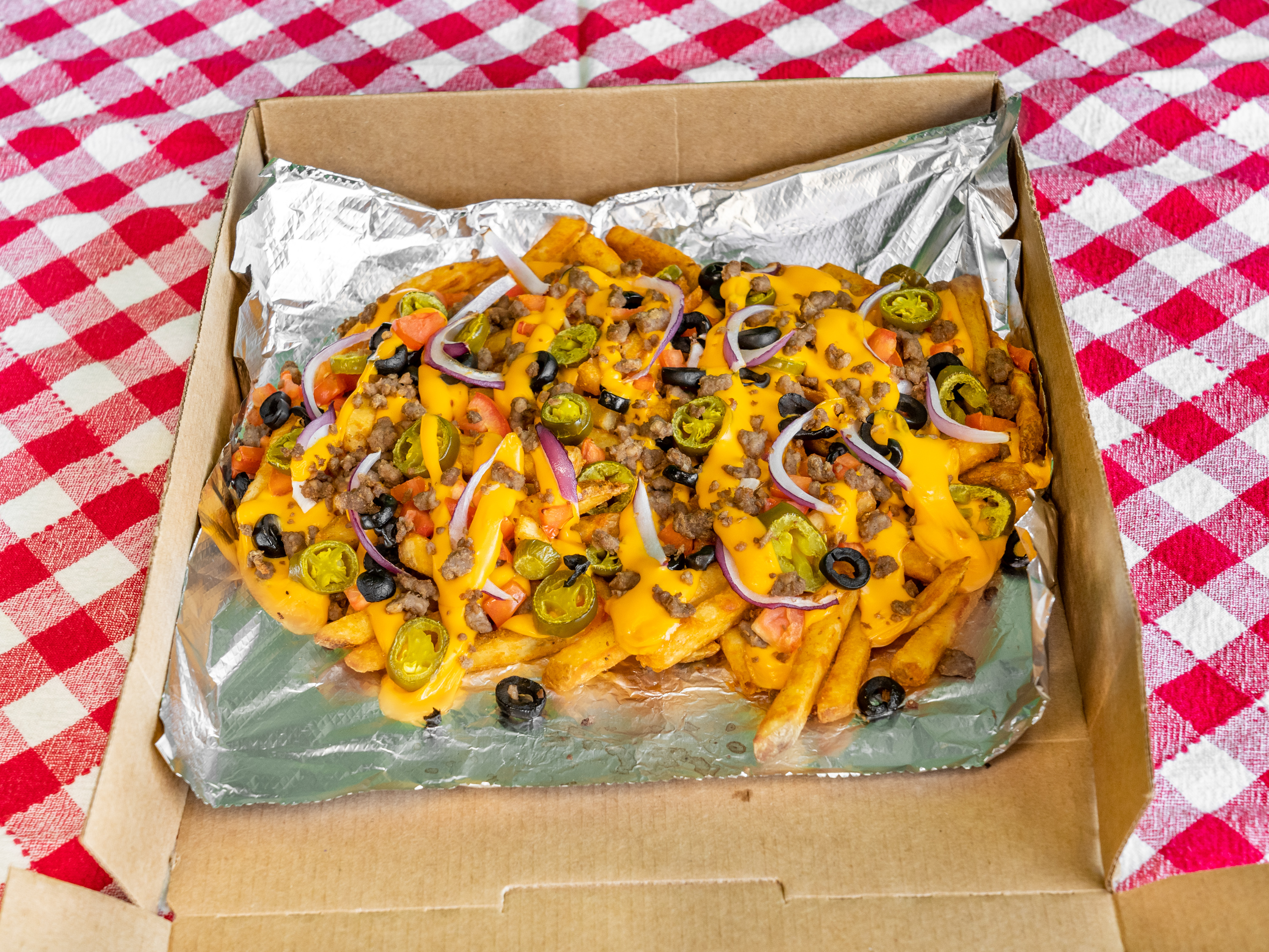 Order Spicy Nacho Fries food online from What Up Dough Pizzeria store, Utica on bringmethat.com