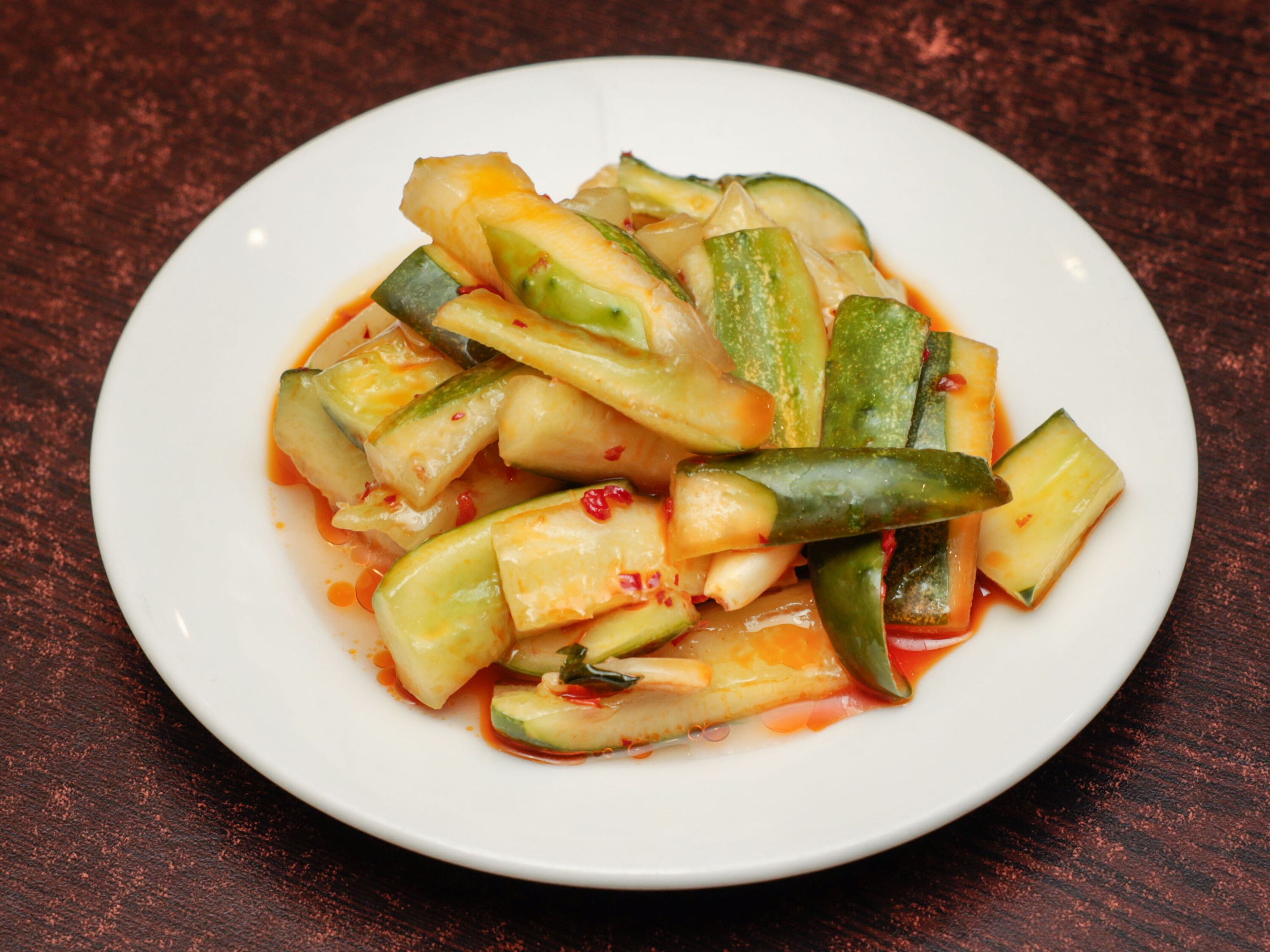 Order Cucumber Salad in Hot Red Sauce 麻辣黃瓜 food online from A&J Bistro 半畝園 store, East Hanover on bringmethat.com