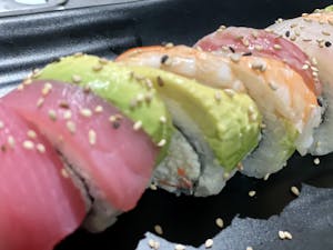 Order Rainbow Roll food online from Aki Sushi & Japanese Fusion store, San Jacinto on bringmethat.com