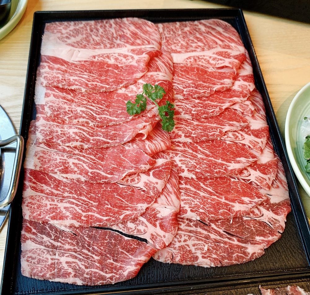 Order 7 oz. American Kobe Beef Premium Wagyu food online from Mumu Hot Pot store, Foster City on bringmethat.com