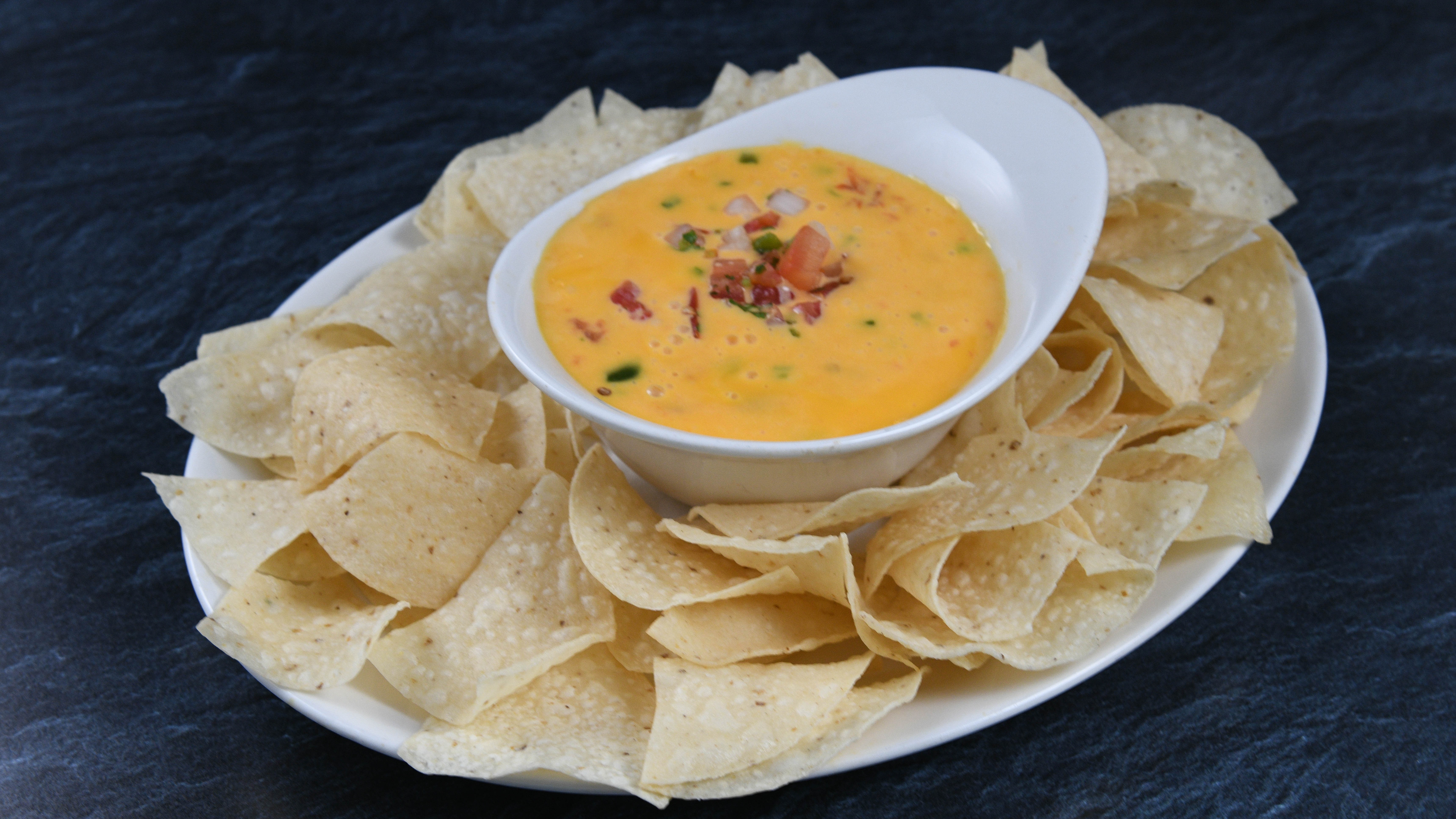 Order Chili Con Queso* food online from Rainforest Cafe store, Atlantic City on bringmethat.com