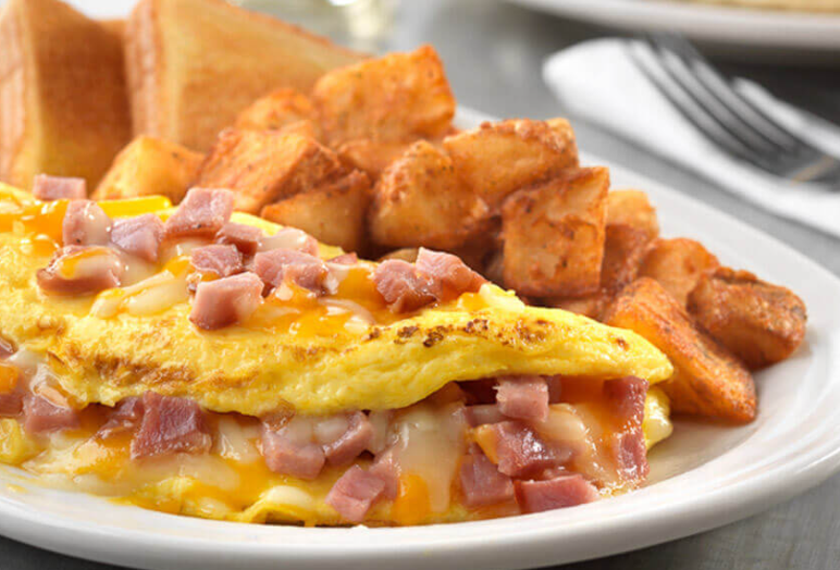 Order Ham Omelet food online from Janik's Cafe store, Chicago on bringmethat.com