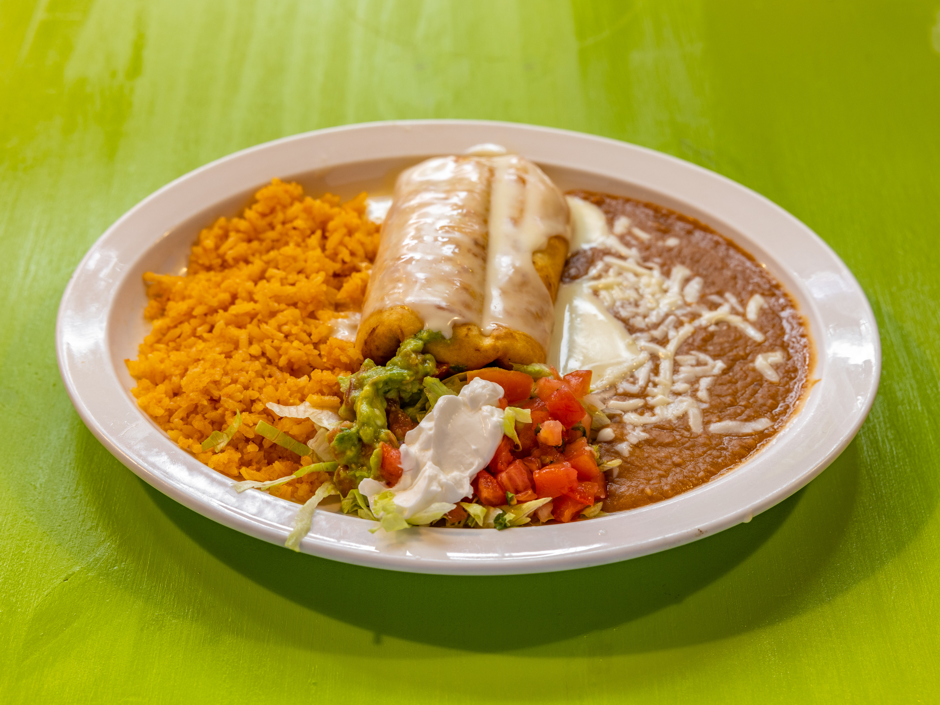 Order Grilled Chicken Chimichanga food online from Los Portales Restaurant & Grocery store, Wentzville on bringmethat.com