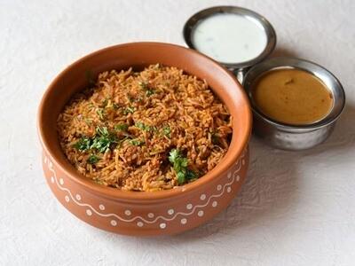 Order Goat Fry Pulav food online from Peacock Indian Cuisine store, Plano on bringmethat.com