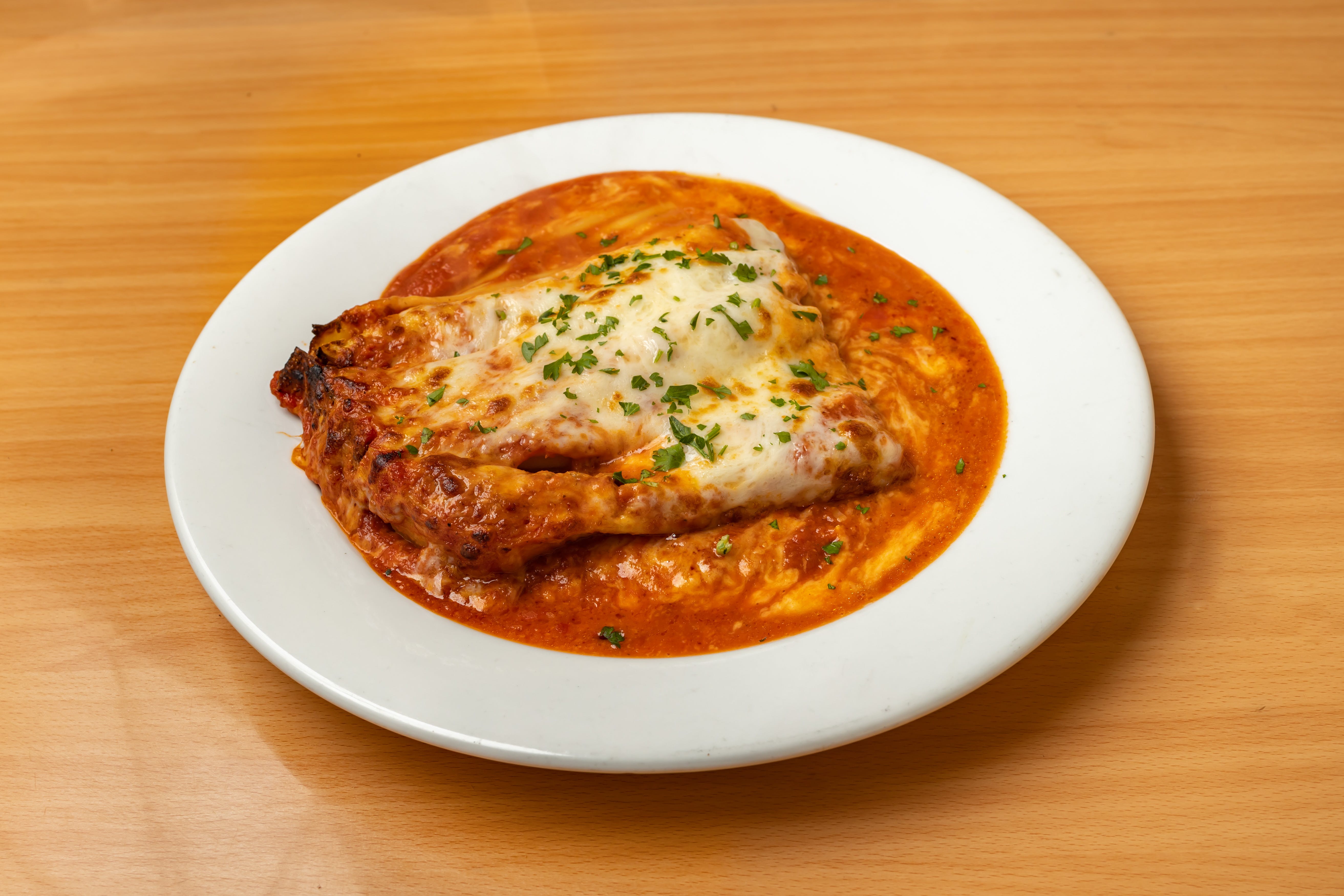 Order Baked Lasagna - Pasta food online from Valentino's store, Fresh Meadows on bringmethat.com