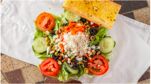 Order Greek Salad food online from Manny's Pizza & Pasta store, Cypress on bringmethat.com