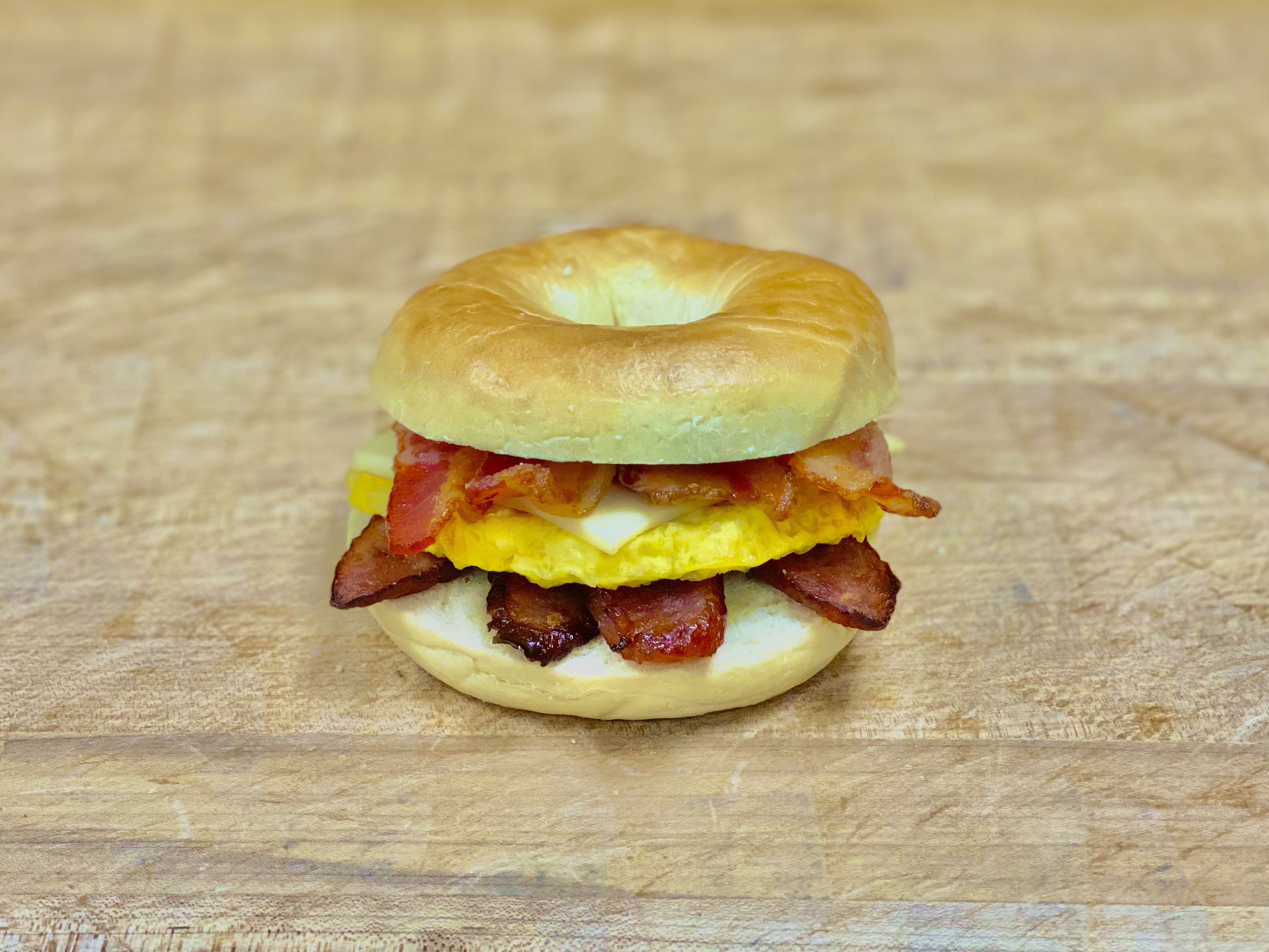 Order B-17 Sausage & Bacon & Egg & Cheese Bagel food online from K-Inn Donuts store, Paramount on bringmethat.com