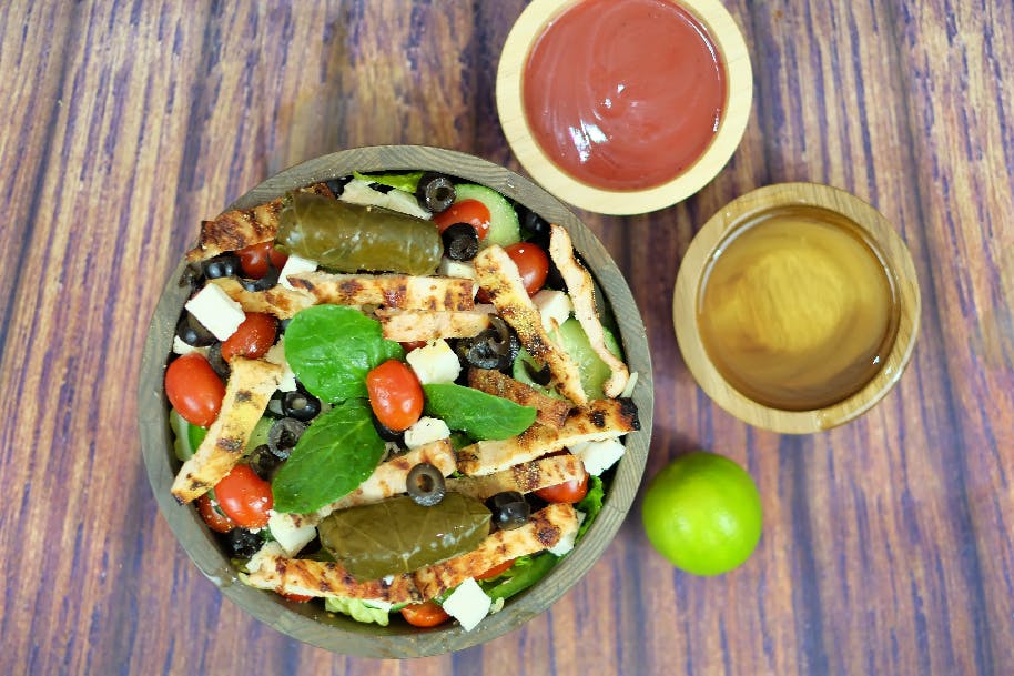 Order Mediterrenean Lemon Pepper Chicken Salad - Salad food online from Oscar's Pizza store, Colonie on bringmethat.com