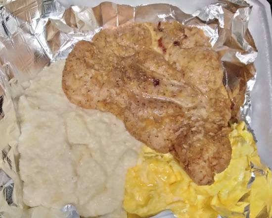 Order 1 Fried Pork Chop and Three Eggs with smoked gouda Grits food online from AGAPE KITCHEN & PRALINES store, Humble on bringmethat.com
