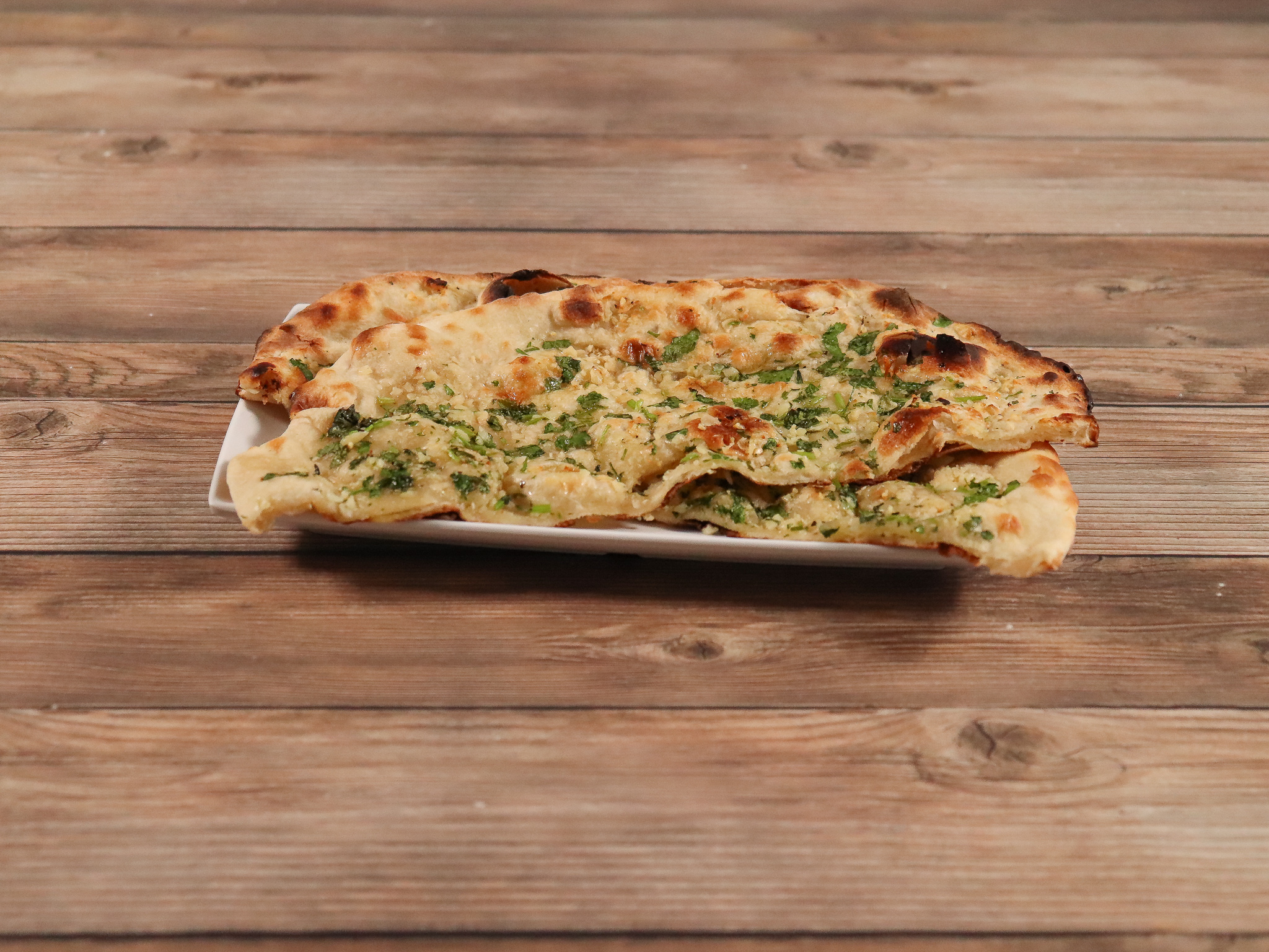 Order Garlic Naan food online from Bombay Palace store, Minneapolis on bringmethat.com