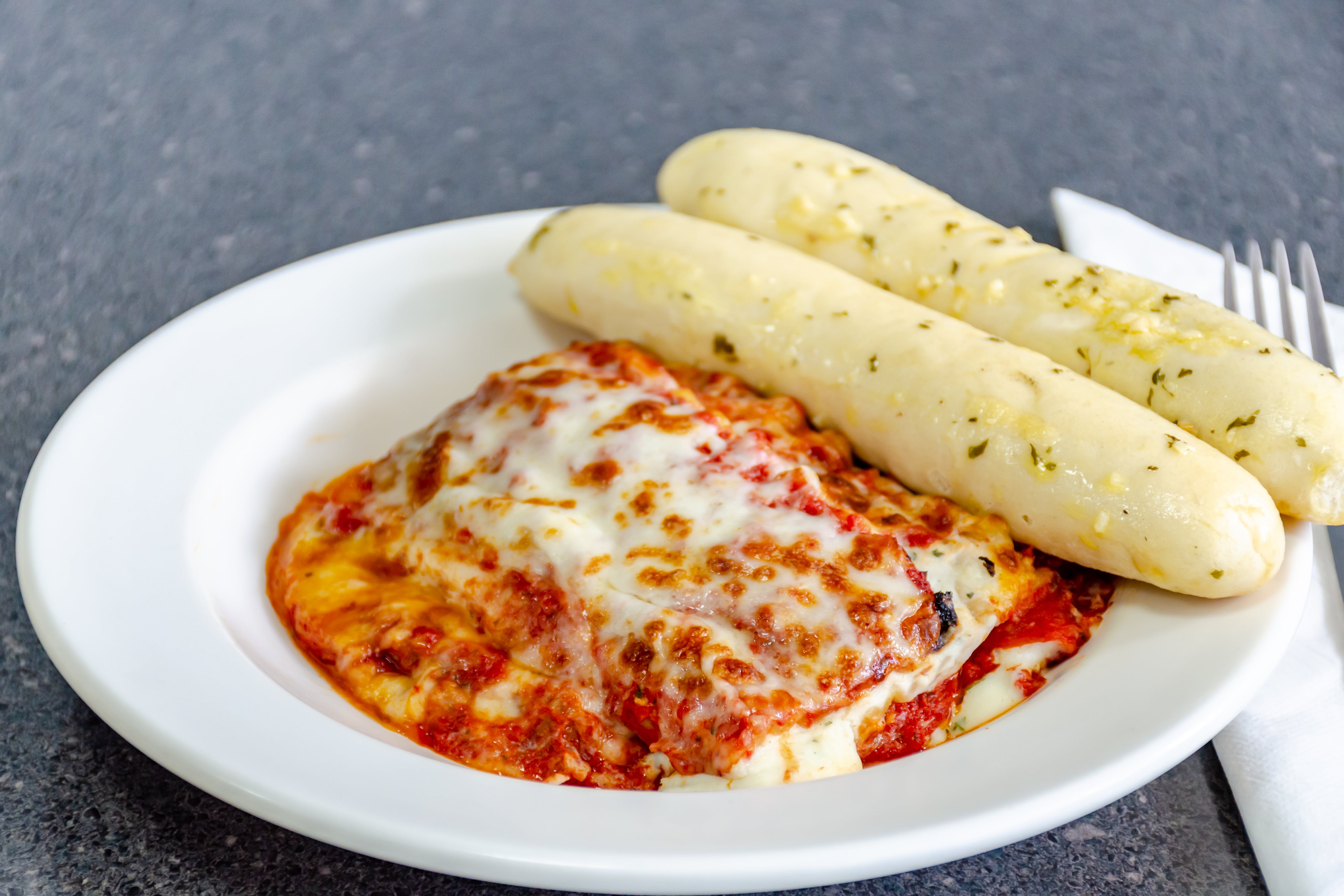 Order Lasagna Dinner - Pasta food online from Hometown Locker Room Pizza & Sub store, St Marys on bringmethat.com