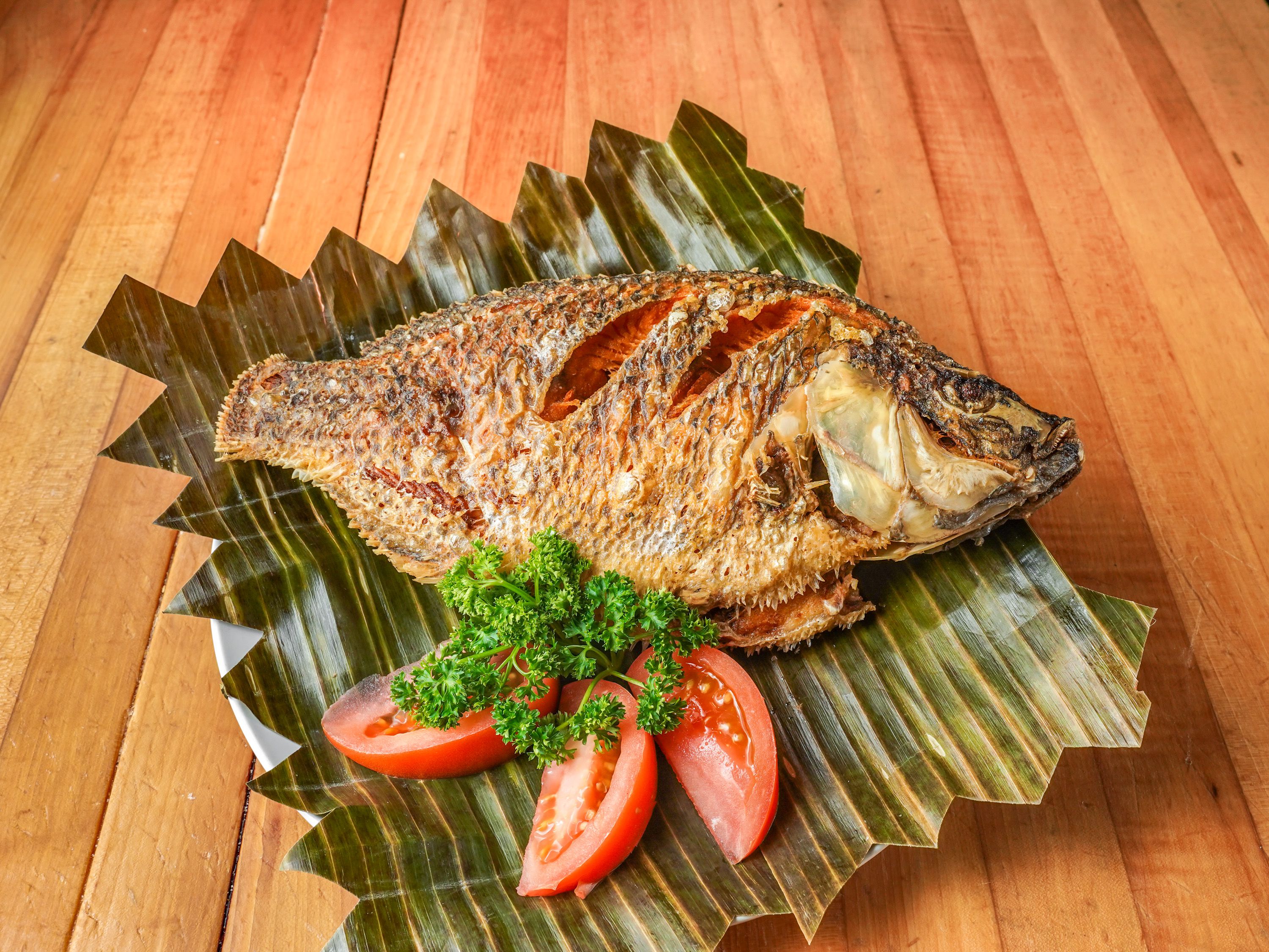 Order Fried Tilapia food online from Bacolod's Best Kitchen store, Chicago on bringmethat.com