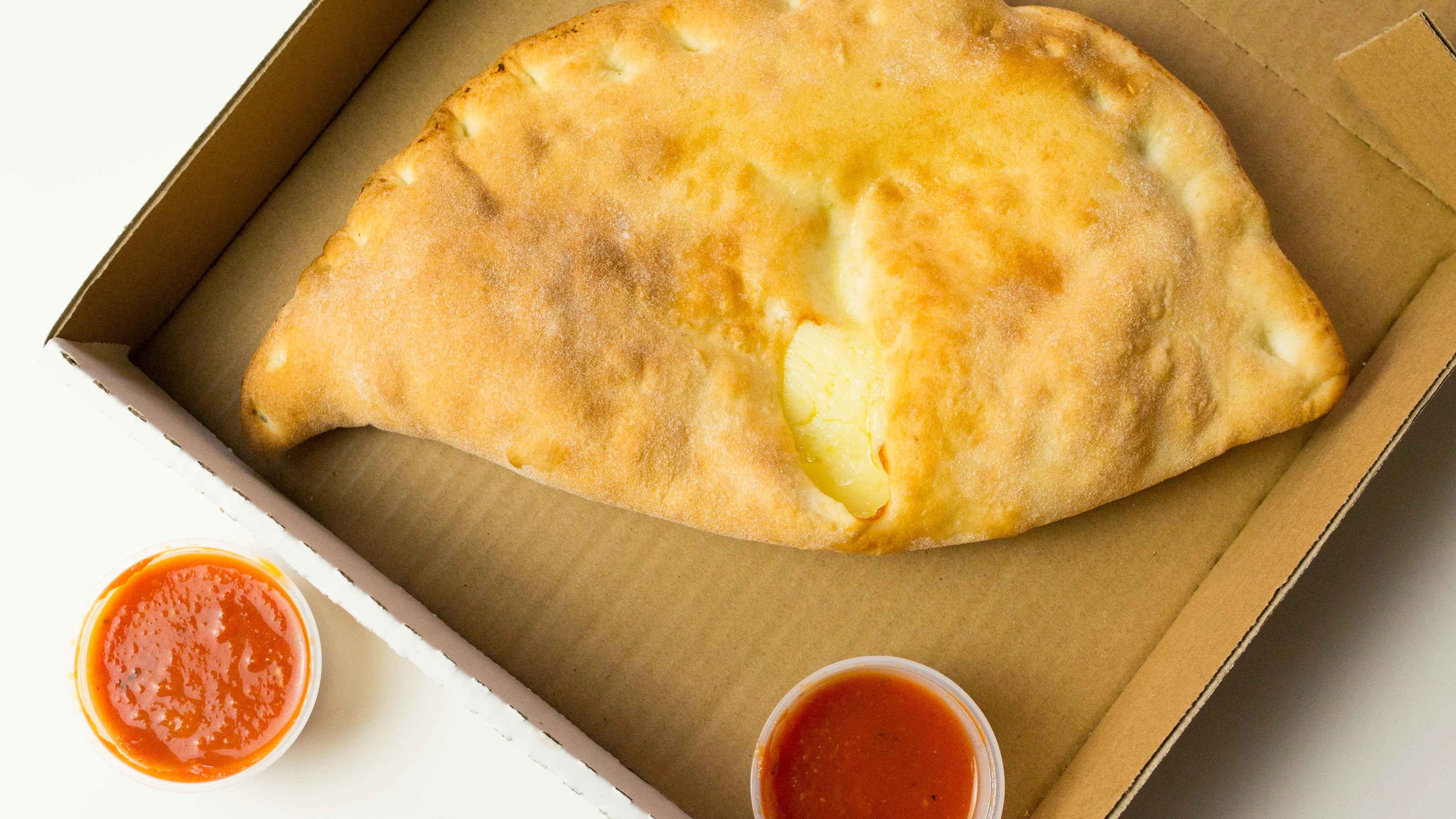 Order Cheese Calzone food online from Rocco's New York Pizza store, North Las Vegas on bringmethat.com