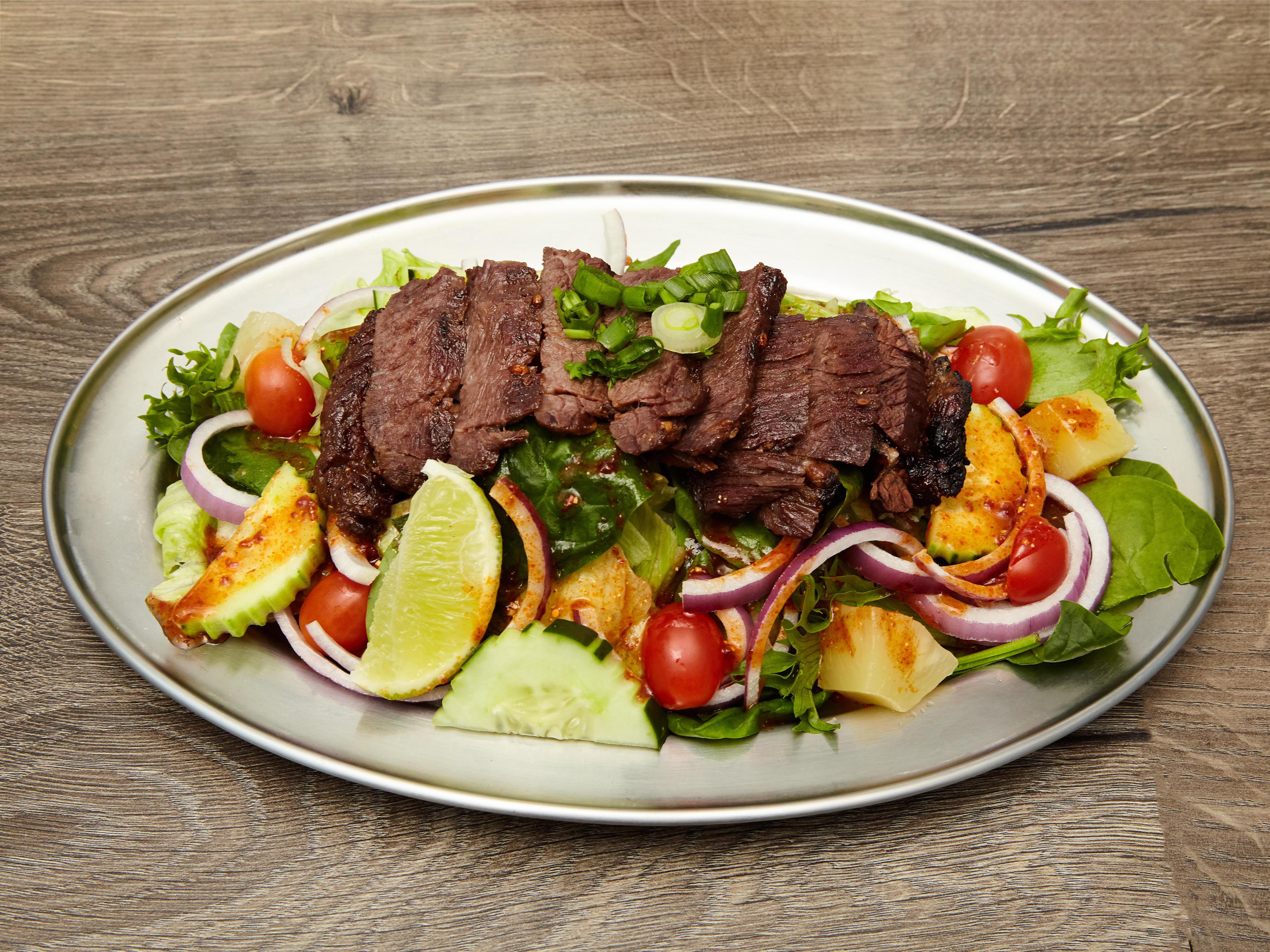 Order B5. Grilled Steak Salad food online from SUROSS Thai Bistro store, New York on bringmethat.com