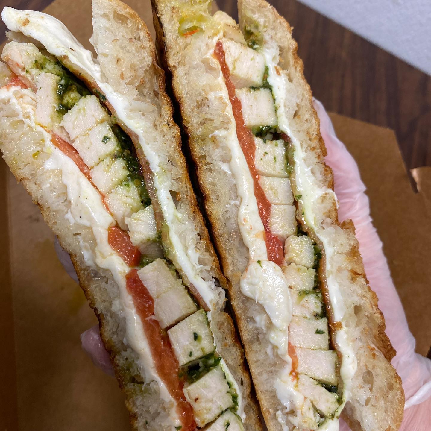 Order Chicken Caprese Panini Sandwich food online from Love Bakery And Cafe store, Branford on bringmethat.com
