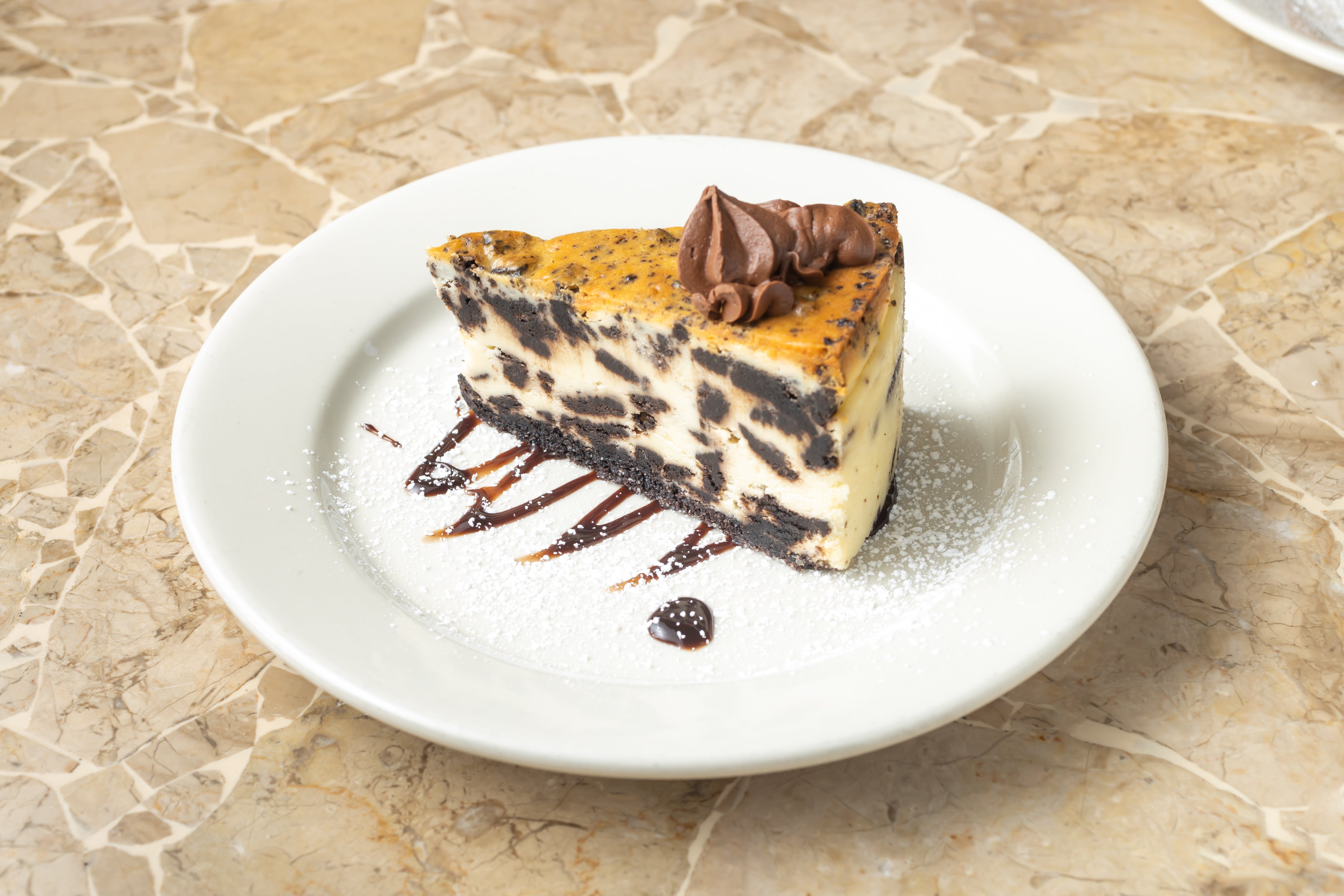 Order Oreo Cheesecake - Dessert food online from Oasis restaurant store, Sunnyside on bringmethat.com
