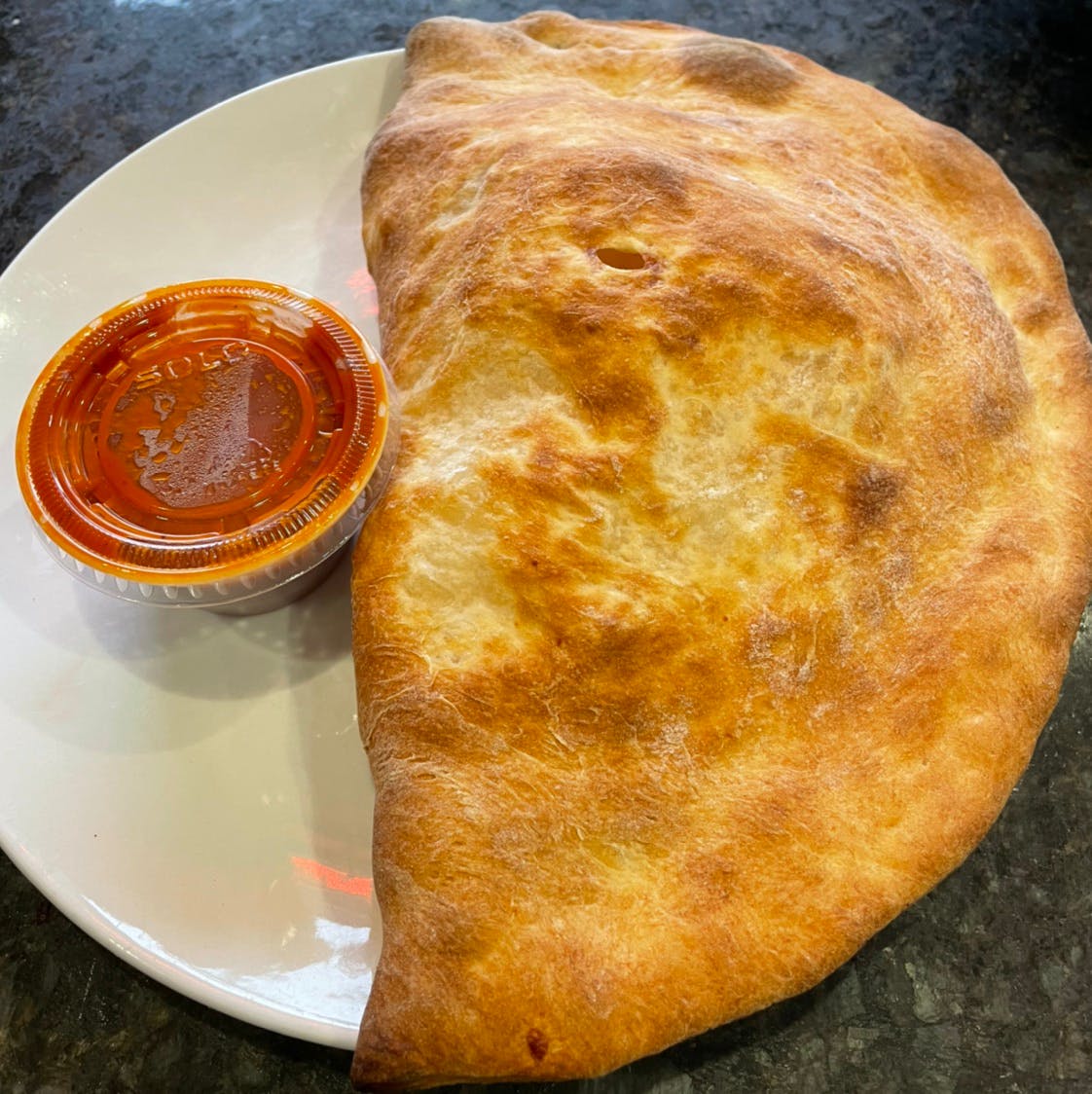 Order Plain Calzone - Calzone food online from Michelangelo's Pizza store, East Brunswick on bringmethat.com