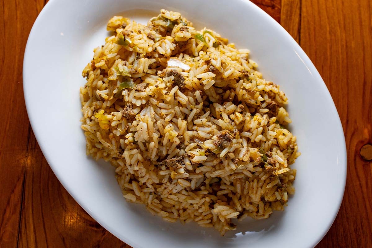 Order Dirty Rice food online from Boudreaux's Cajun Kitchen store, Houston on bringmethat.com
