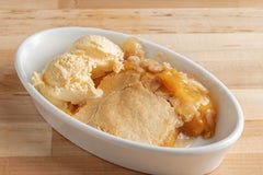 Order Peach Cobbler & Cream food online from Spring Creek Barbeque store, Shenandoah on bringmethat.com