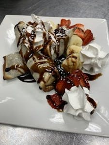 Order Nutella Crepes with Bananas and Crushed Strawberries food online from Bistro 1051 store, Clark on bringmethat.com