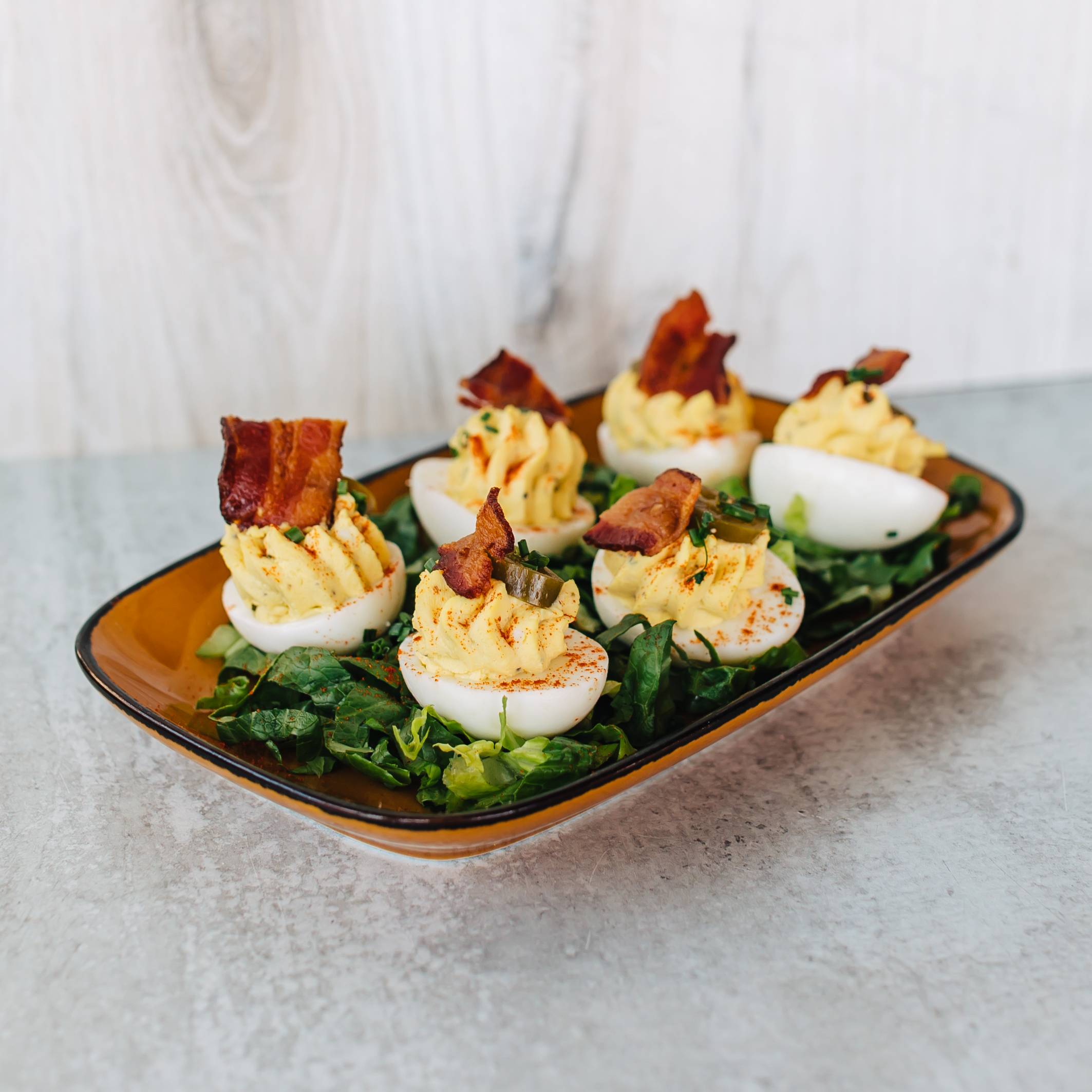 Order Jalapeno 'Bedeviled' Eggs food online from Jimmy Famous American Tavern store, Dana Point on bringmethat.com