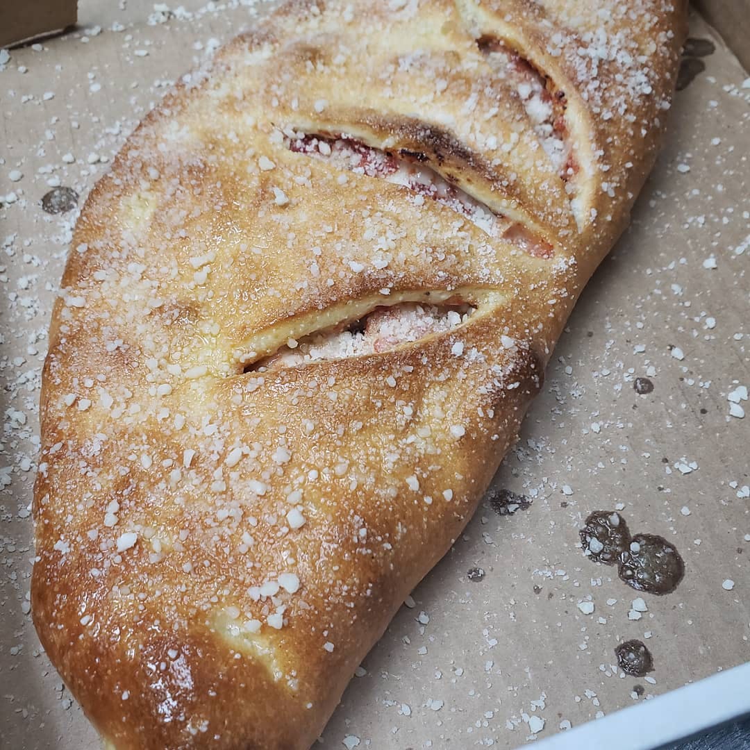 Order Cheese Calzone - Calzone food online from Zino's Subs Pizza & Catering store, Livonia on bringmethat.com