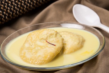 Order Rasmalai (2 Pieces) food online from Swad Indian and Nepalese Cousine store, Fort Worth on bringmethat.com