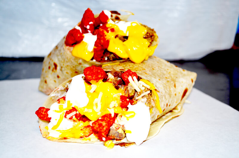 Order Flaming Hot Cheetos Burrito food online from D'Leon's Mexican Food store, Lincoln on bringmethat.com