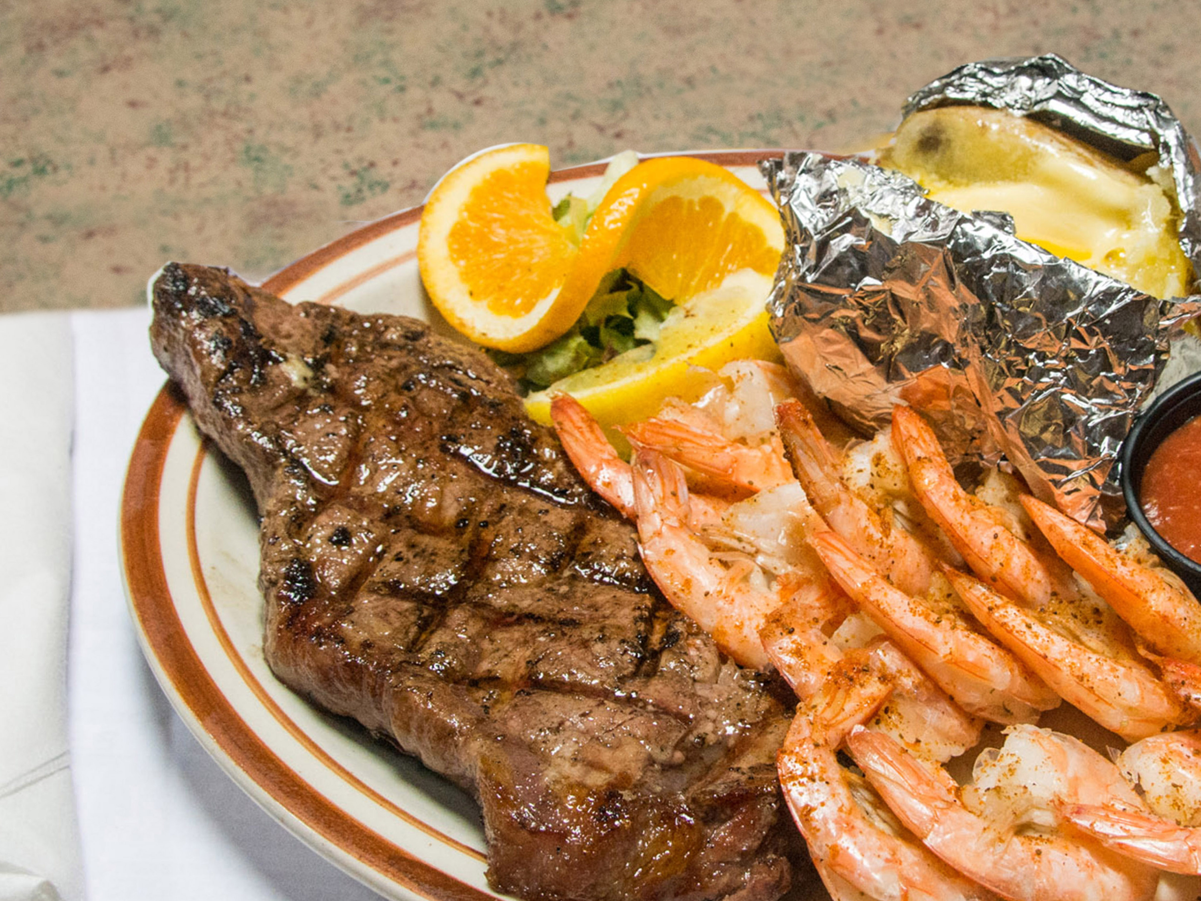 Order Surf and Turf Dinner food online from T N C's Lounge store, Johnstown on bringmethat.com