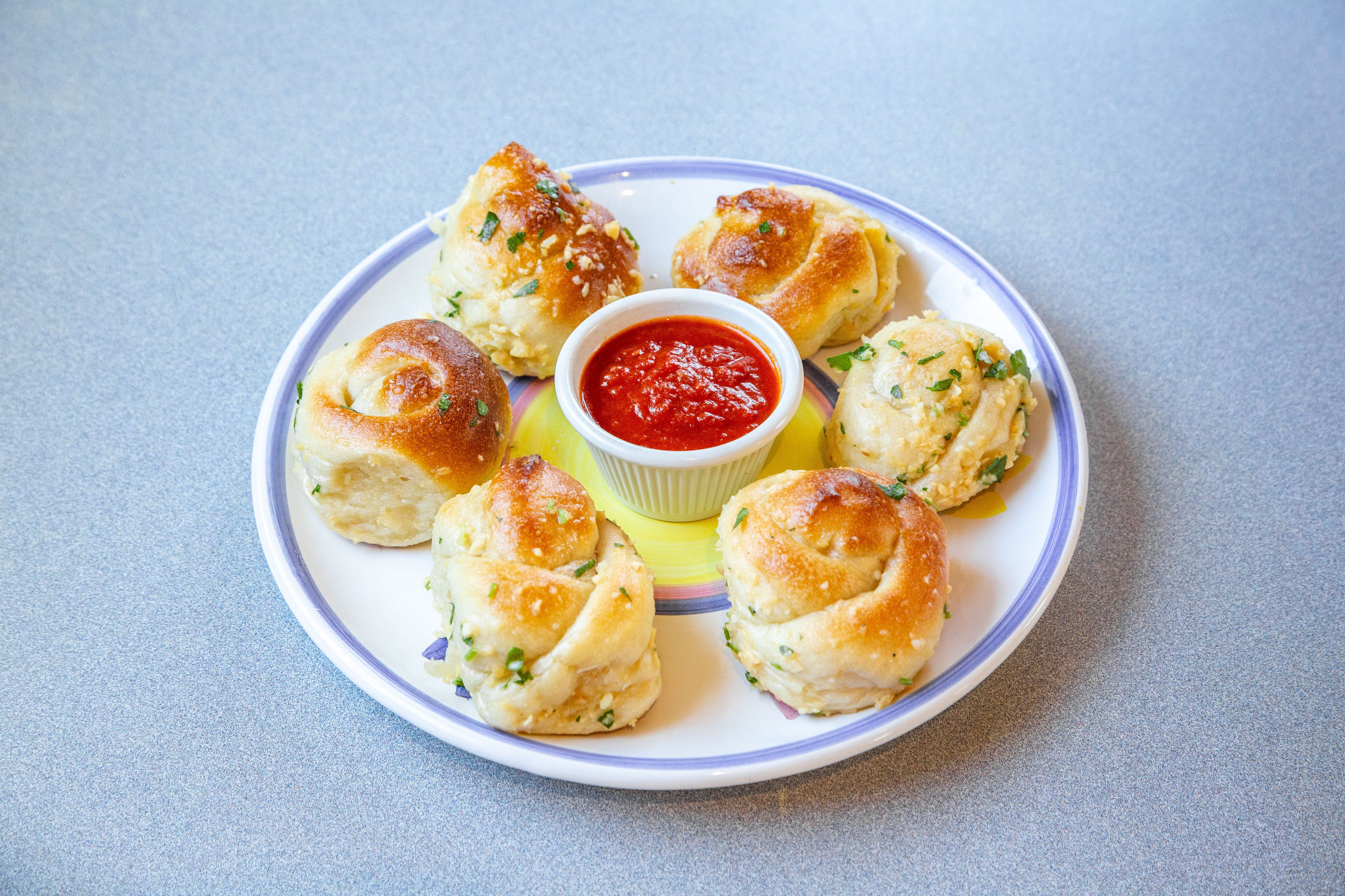 Order Garlic Knots - 6 Pieces food online from Pezzi Pizza store, Sea Cliff on bringmethat.com