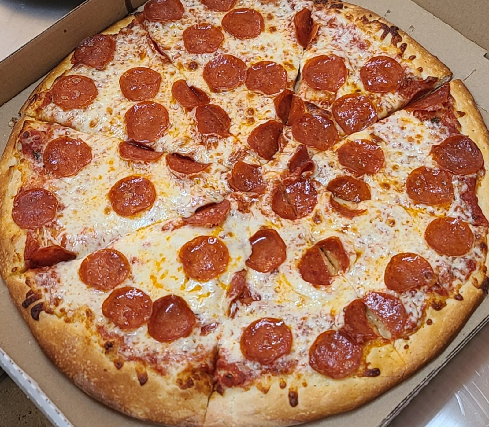 Order Pizza with One Topping - Small 12'' (8 Slices) food online from De Angelo Pizzería store, San Diego on bringmethat.com