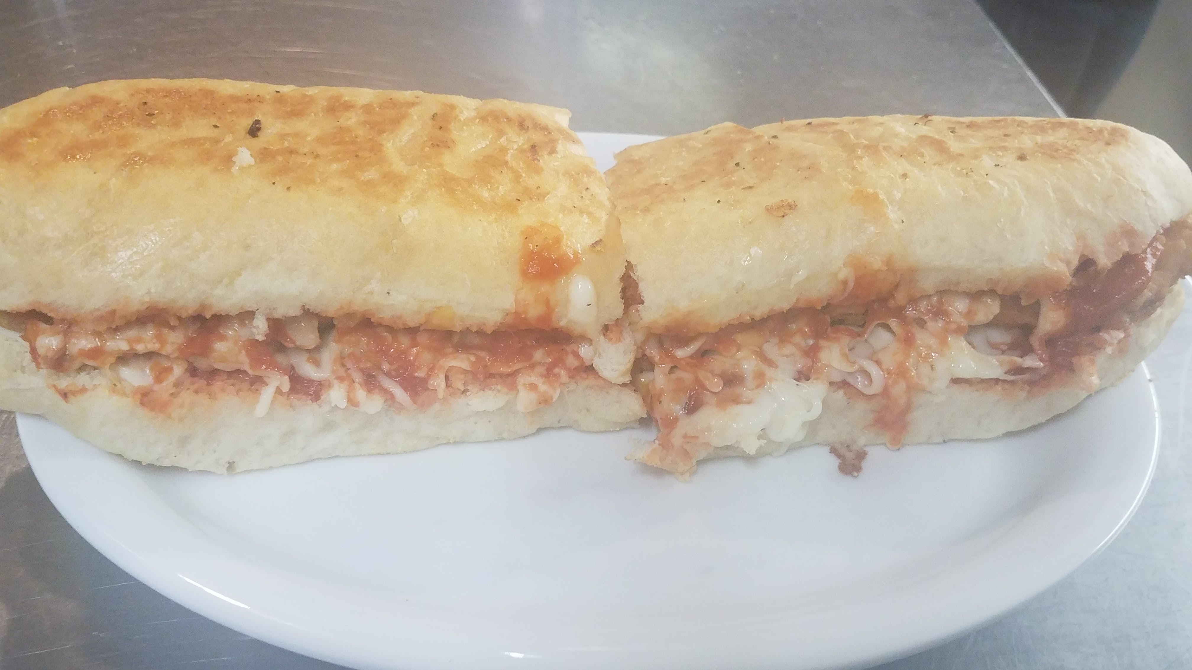 Order Chicken Parm Po Boy Sandwich - Half food online from The Pizza Den store, Hoxie on bringmethat.com