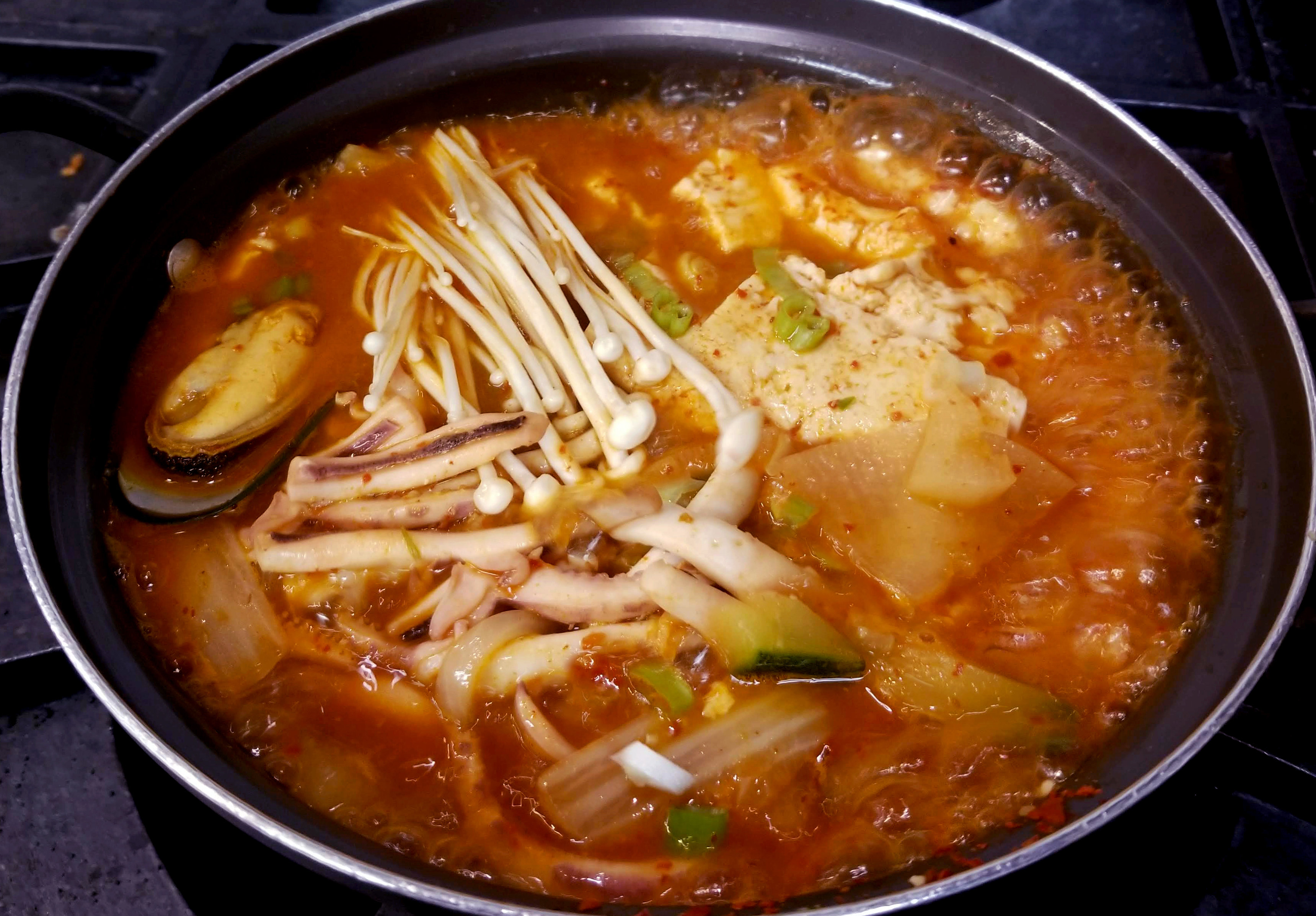 Order 26. Squid Jjigae food online from Spoon House store, Champaign on bringmethat.com