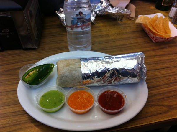 Order Deluxe Burrito food online from Pancho Villa Taqueria store, San Francisco on bringmethat.com