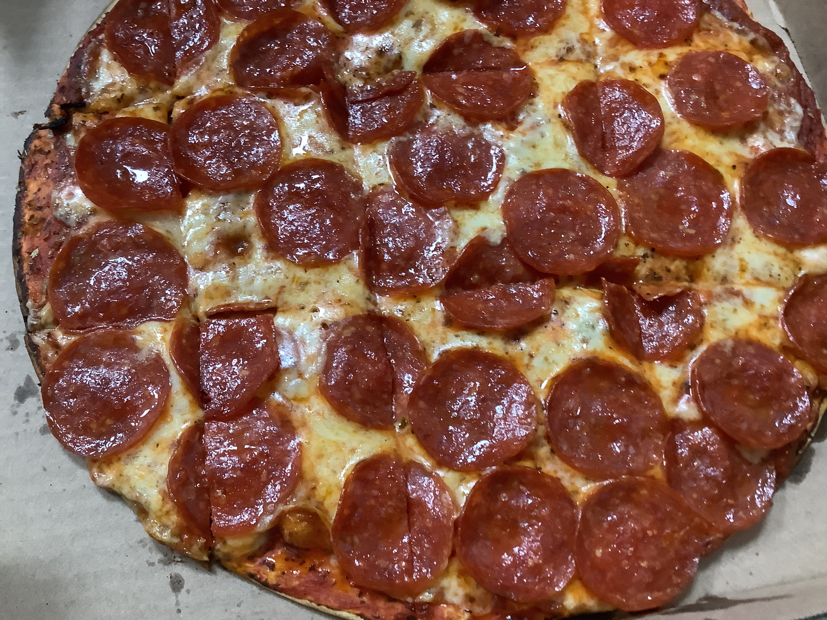 Order One Topping Pizza - X-Small 10'' food online from Pizza Garden store, Manitowoc on bringmethat.com