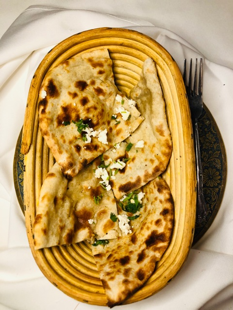 Order Cheese Naan food online from New Delhi Restaurant store, San Francisco on bringmethat.com