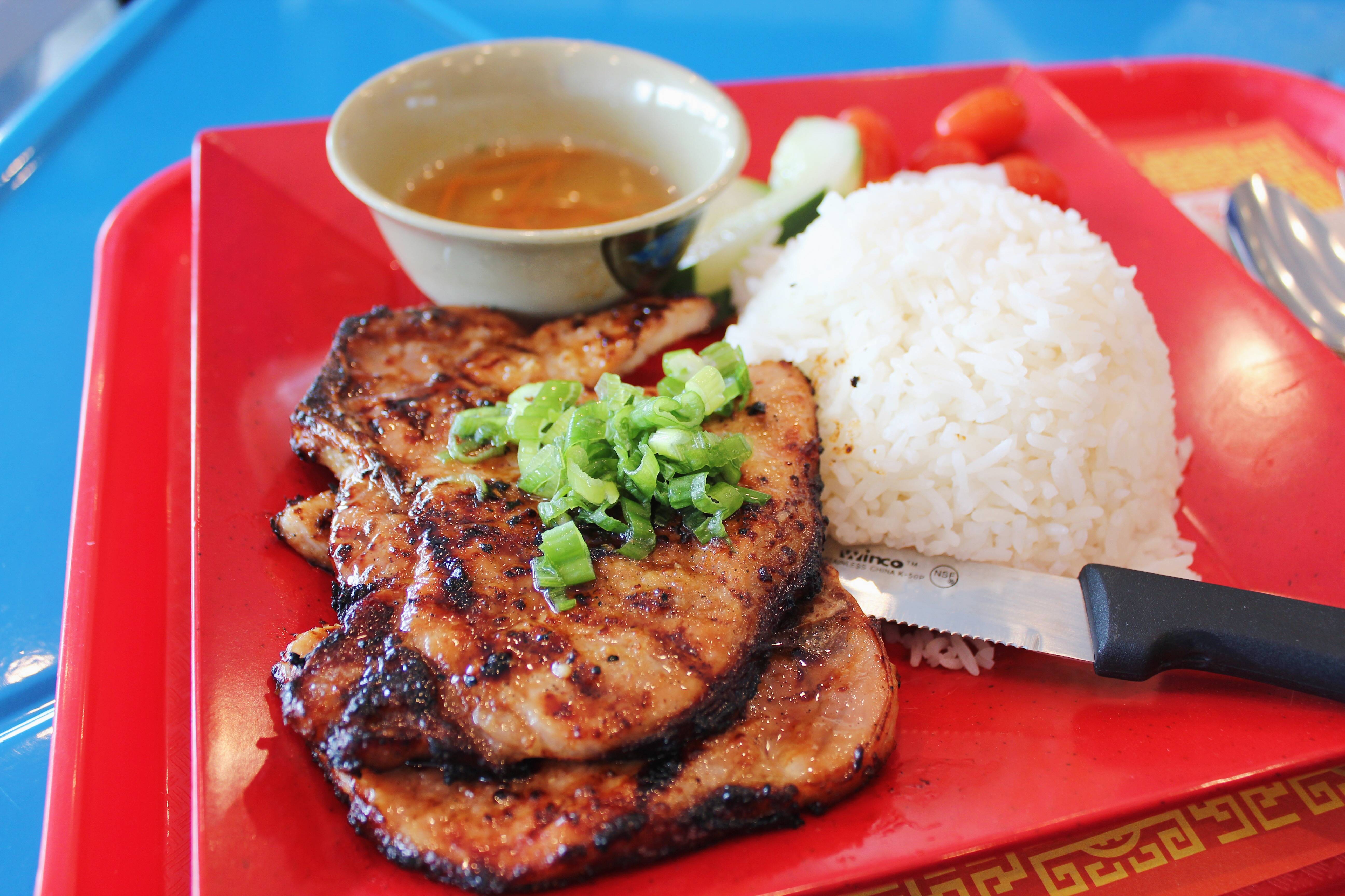 Order Grilled Pork chop with steamed rice food online from Saigon Banh Mi store, Newark on bringmethat.com