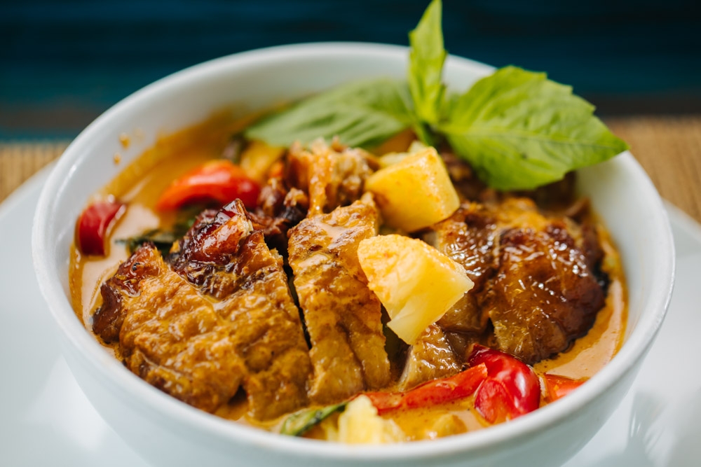 Order Red Curry Pineapple Duck food online from Banana Leaf Thai Restaurant store, Dallas on bringmethat.com