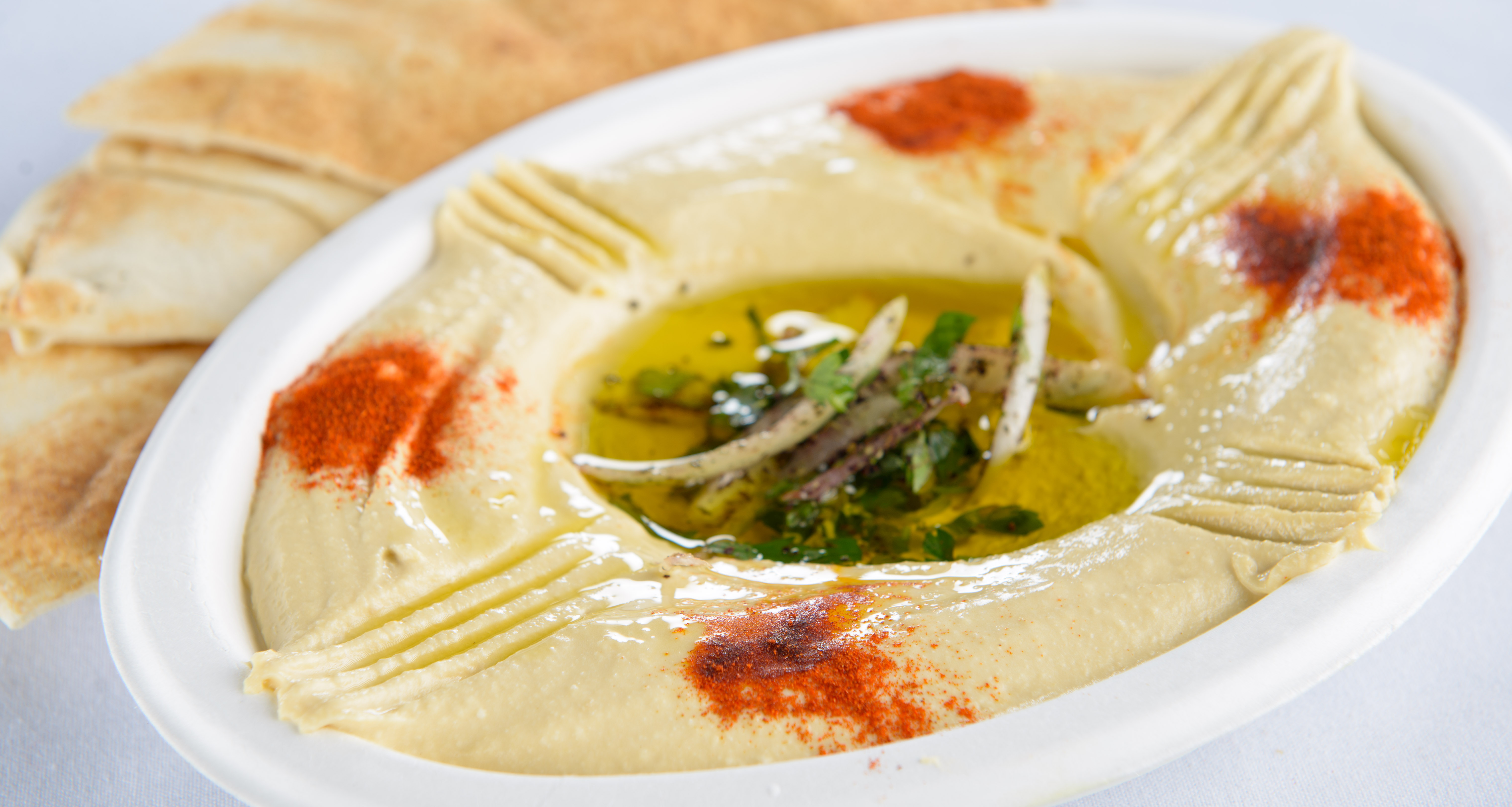 Order 41. Hommous Topped with Olive Oil food online from Shawarma King - Brookline store, Brookline on bringmethat.com